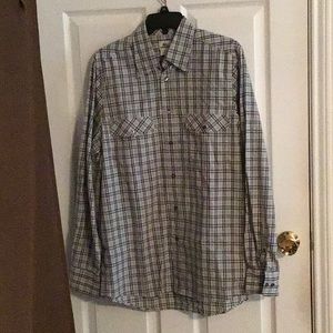 Long sleeves dress shirt by Lacoste with 2 front pockets.